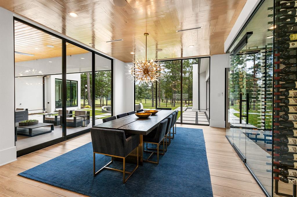 The formal dining is surrounded by sliding glass doors that open to both outdoor venues.