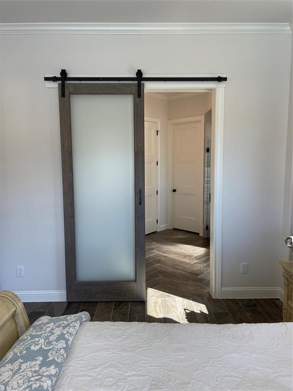 Custom woodwork and barn door from master bedroom to bathroom