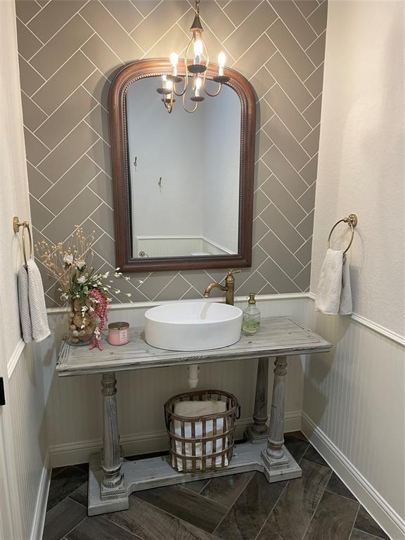 Full bathroom downstairs with custom vanity