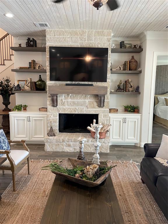 Cozy fireplace with stone and custom built ins