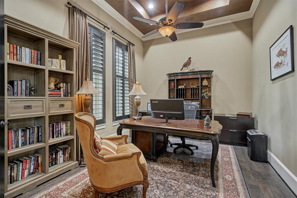 The Study/Library is to the left of the grand entrance and closed off with French doors for privacy.