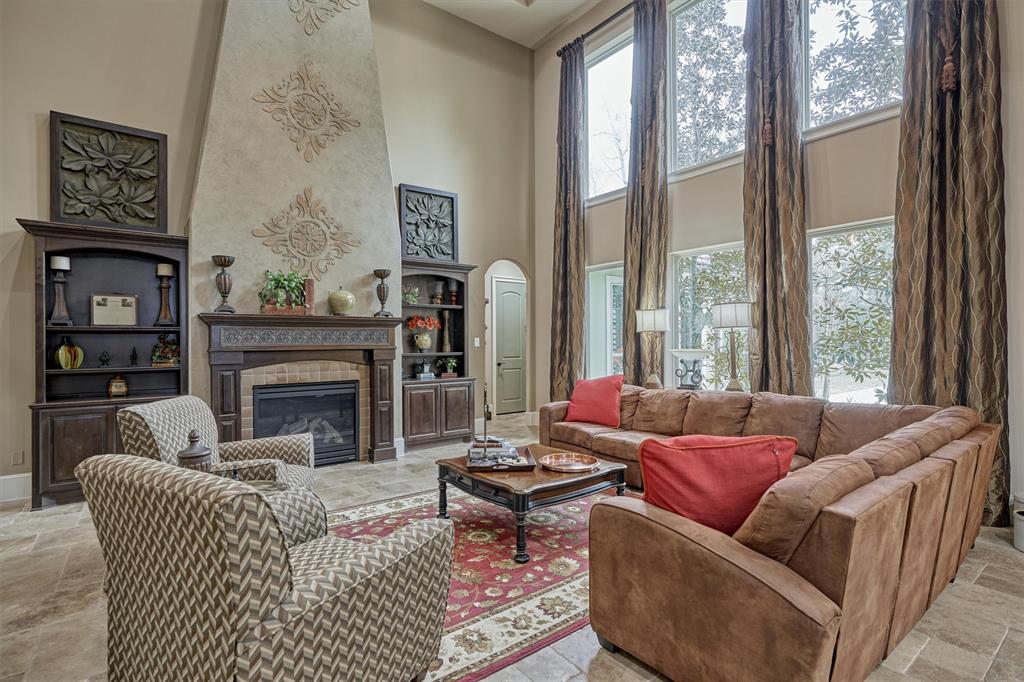 The Family Room has custom built-ins, and a gas log fireplace.