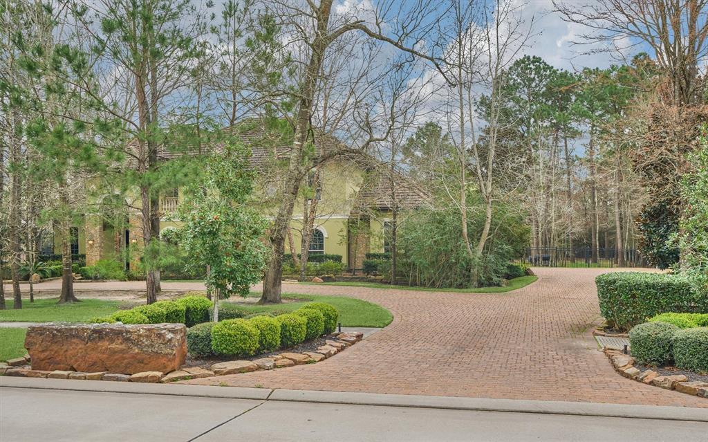 This estate is set back from the street with a large circular drive, and parking court leading to the garage.