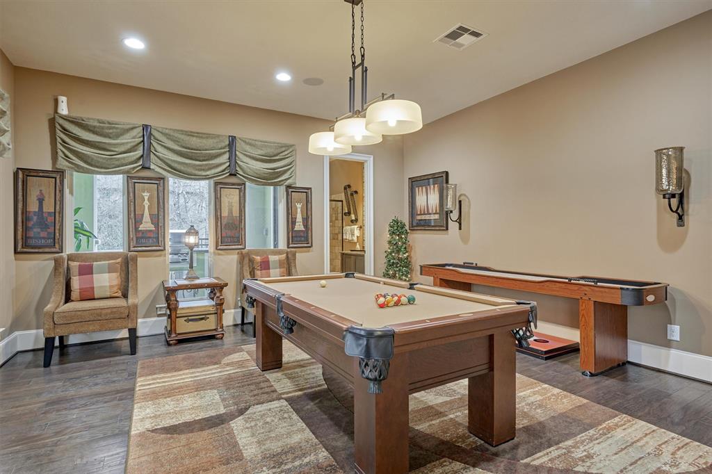 The downstairs Game Room is off of the Kitchen and has an adjacent full Pool Bath.
