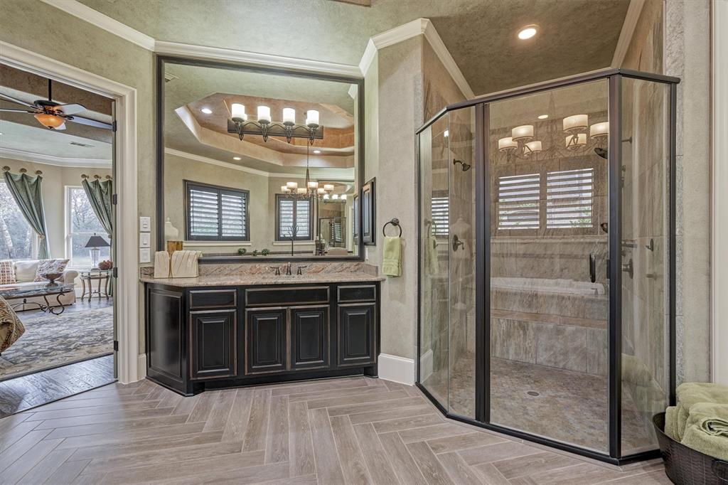 Another view of the large Primary Bath with a large walk-in closet and built-ins.