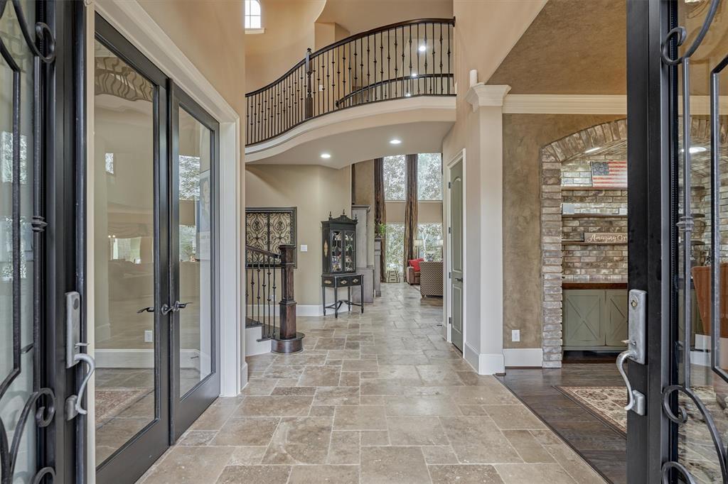 Grand two story entrance. Travertine, and wood floors throughout all of the downstairs living areas.