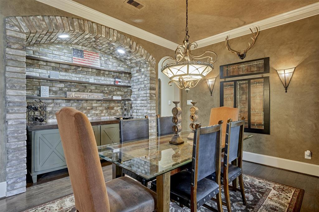 The formal Dining Room is to the right of the entrance and includes custom built-ins, separate entrance to the Kitchen, and more.