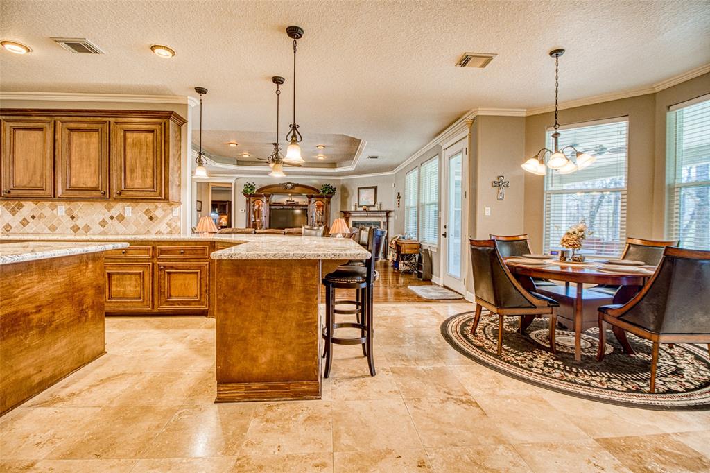 The expansive kitchen and breakfast area links the mother in law suite to the main living room area for easy access.
