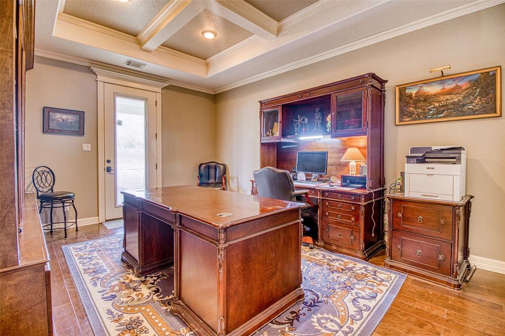 [Office] Richly detailed wood work on ceiling and cabinetry in this professional office with access to the front porch.