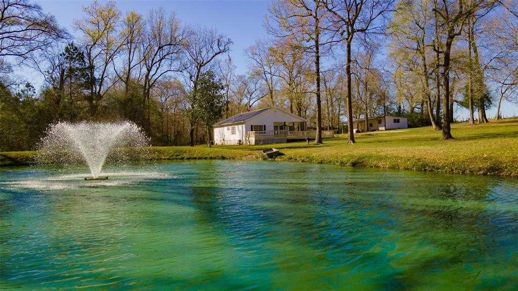 [Pond] This 1/2  acre pond is fully stocked and the electric fountain runs on a timer for easy maintainability.