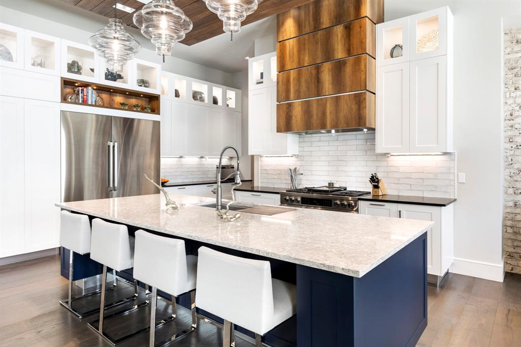 Entertainers Kitchen: Quartz counters, Madeval cabinets, Dacor high-end appliances and stunning wood venthood.