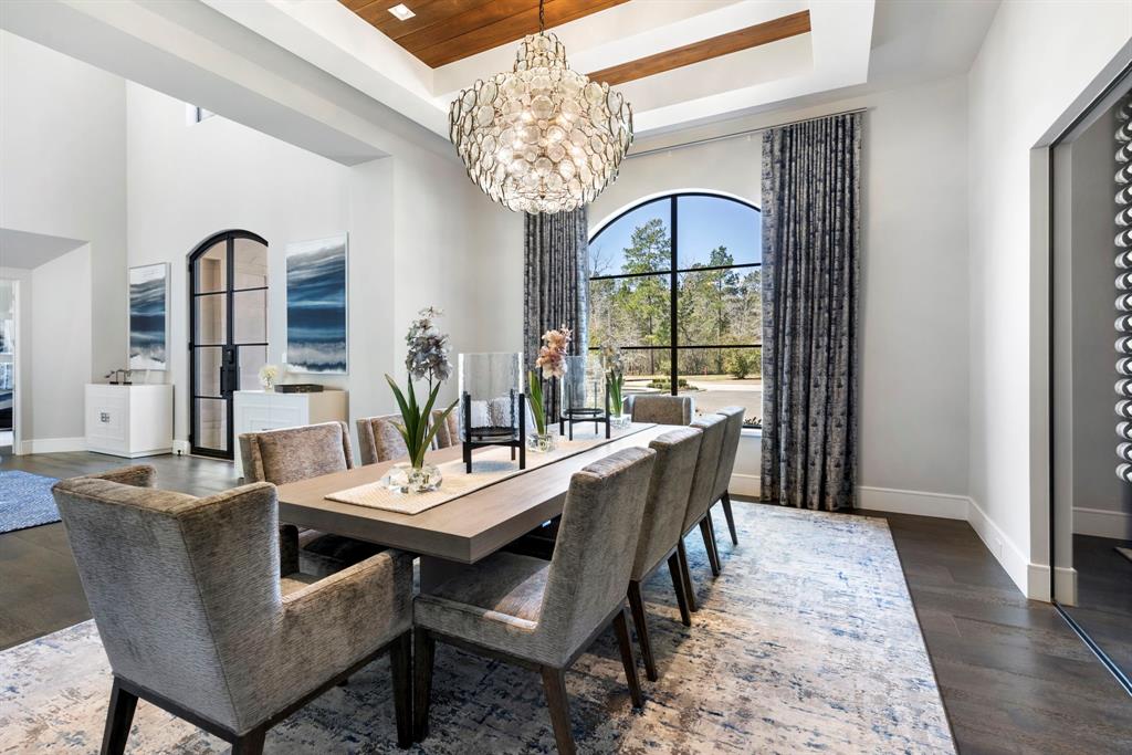Formal Dining: A place to bring friends and family together, this space showcases a bronze, recycled glass chandelier.