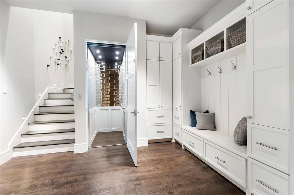 MUD Room and Elevator: Pull out drawers, bench and locker cabinets keep everyone and everything organized.