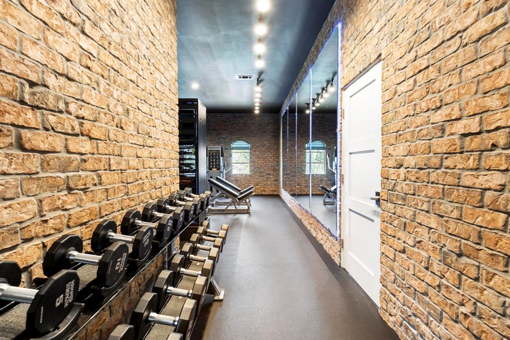 Home Gym: brick entry leads the way to a personal gym with everything you need for home workouts.