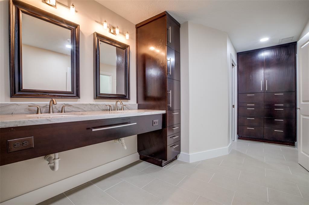 Primary bath with double sinks and custom cabinets