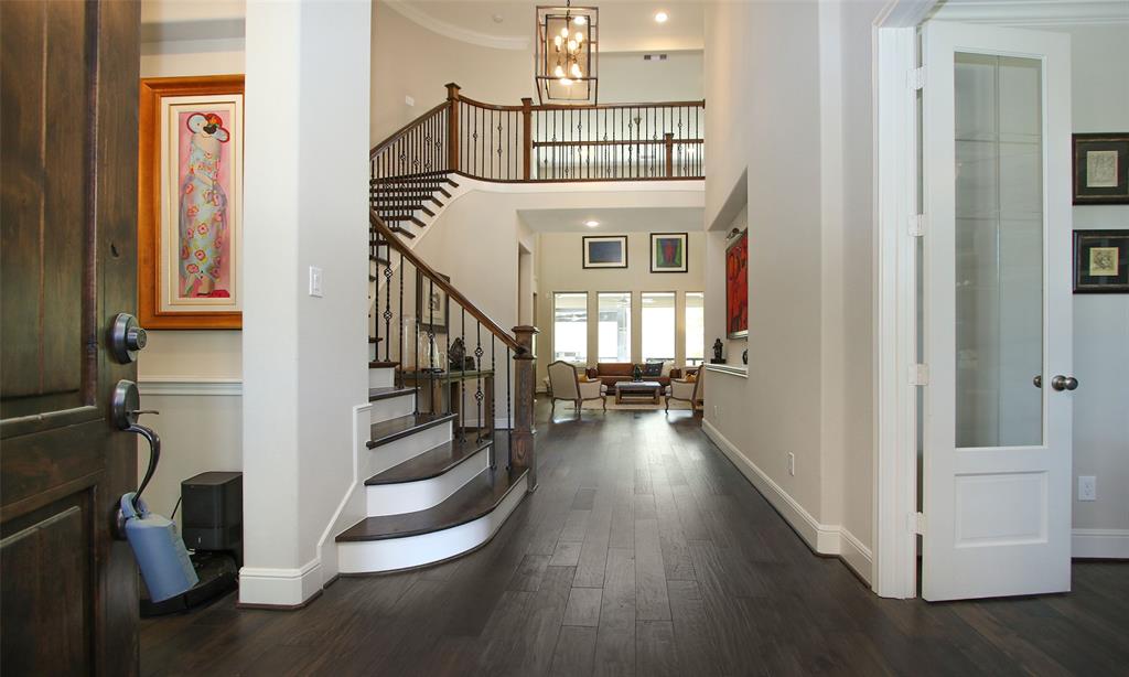 A Striking First Impression Upon Entering The Home!  The Interior Features Modern Neutral Colors Thru-Out, Tall Baseboards, High Ceilings, And Wood Flooring Thru-Out The First Floor!