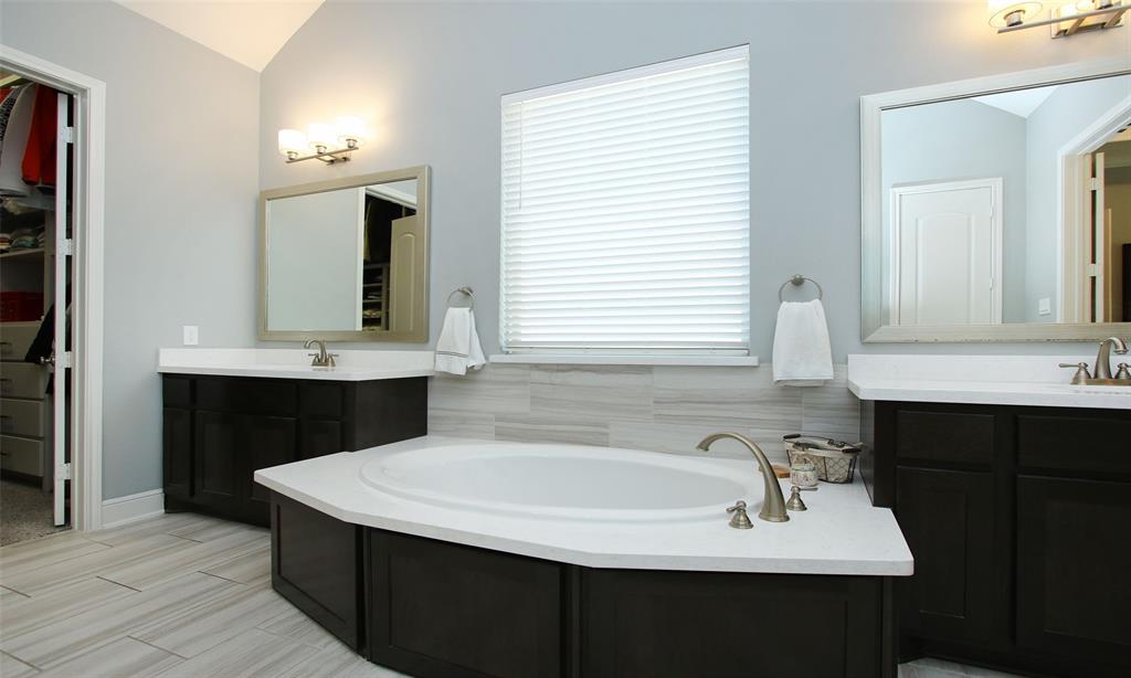 Elegant Soaking Tub And Book-End Vanities .... The Large Obscure Glass Window Fills The Bath With Natural Light