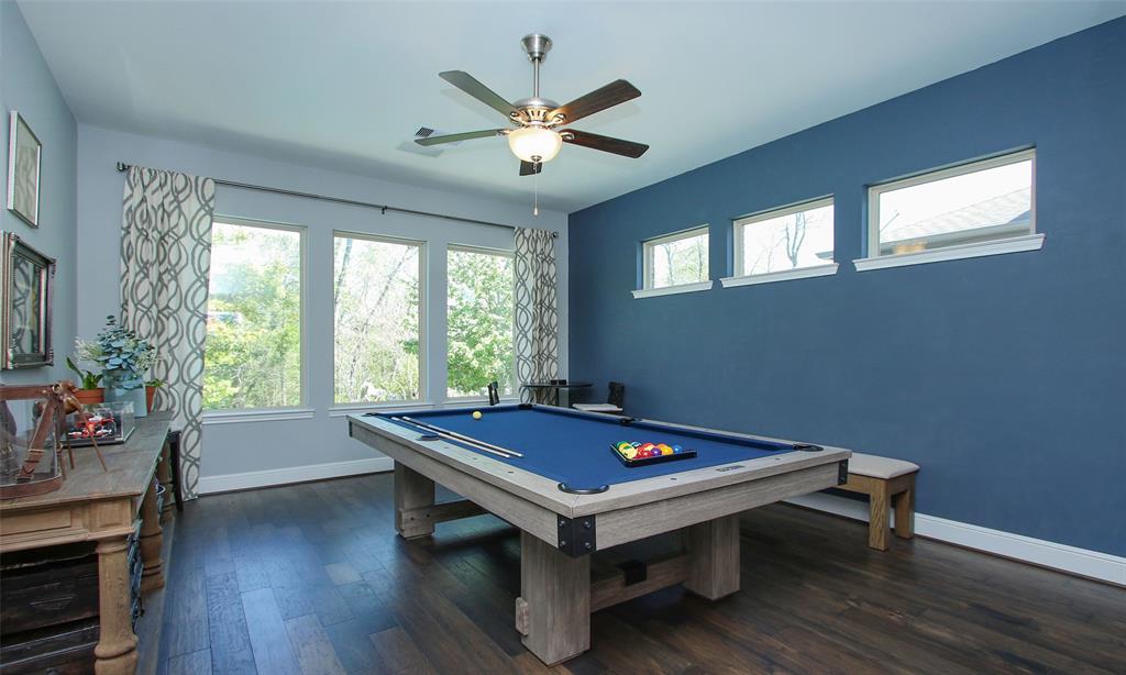 Awesome First-Floor Game Room Is Fantastic For Both Family Fun & Entertaining .... No Trudging Up The Stairs To Get To The Game Room!  Large Windows Provide An Amazing View Of The Backyard Paradise And Greenbelt!