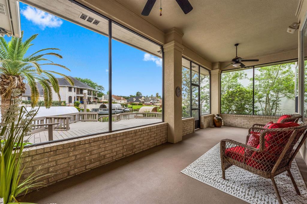 Outside is an entertainers dream w/ a large screened-in porch w/ surround sound perfect for enjoying the sunset & leads to the recently redone expansive deck, covered boat slip, & lift with a pier to fish on.