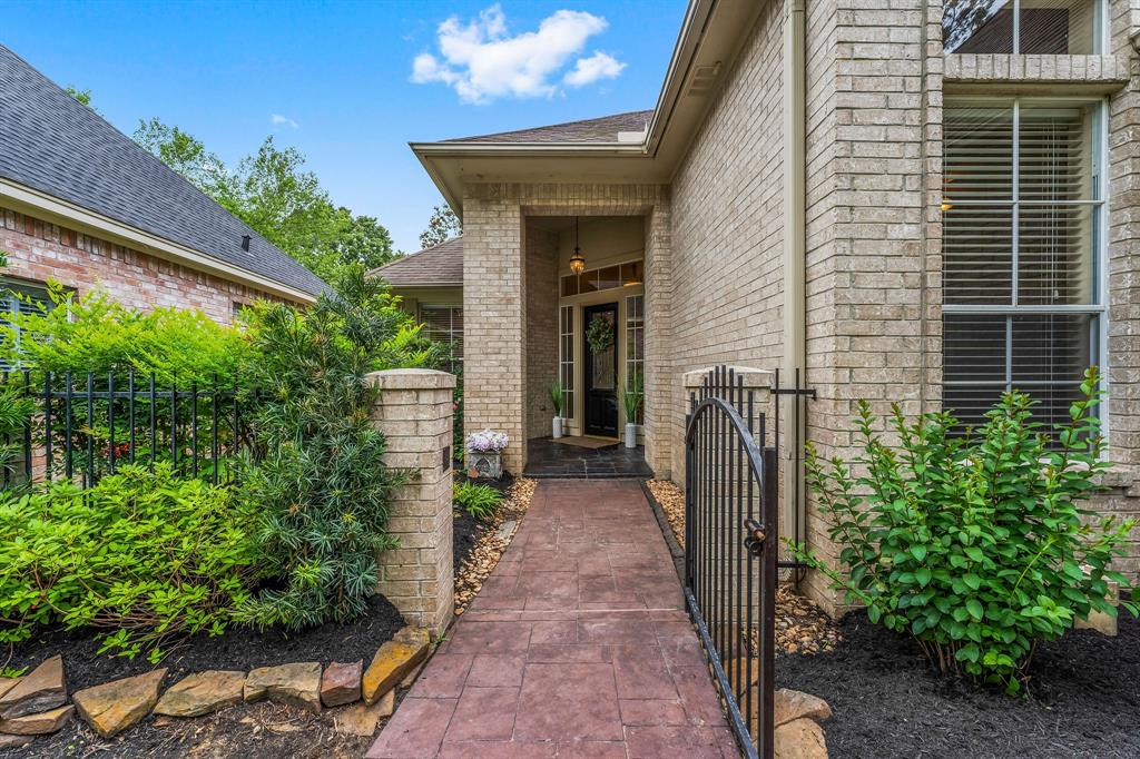 Gated entry for additional privacy. Beautifully landscaped front yard with 2 car garage and large driveway for additional parking.