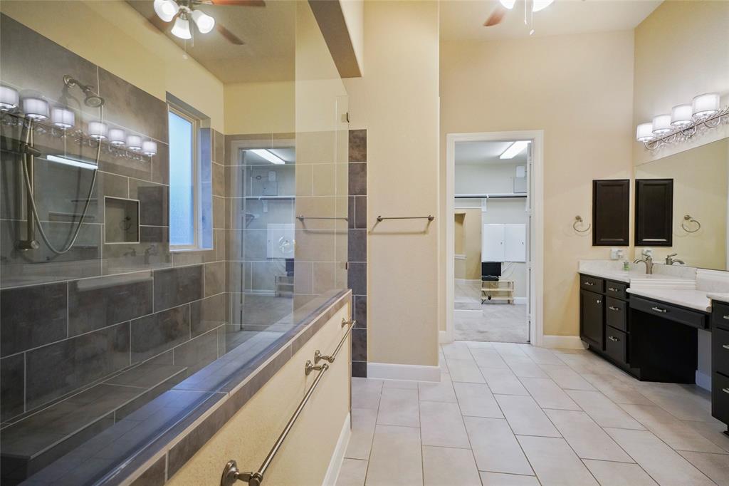 Primary bathroom with oversized shower and double sinks and vanities.