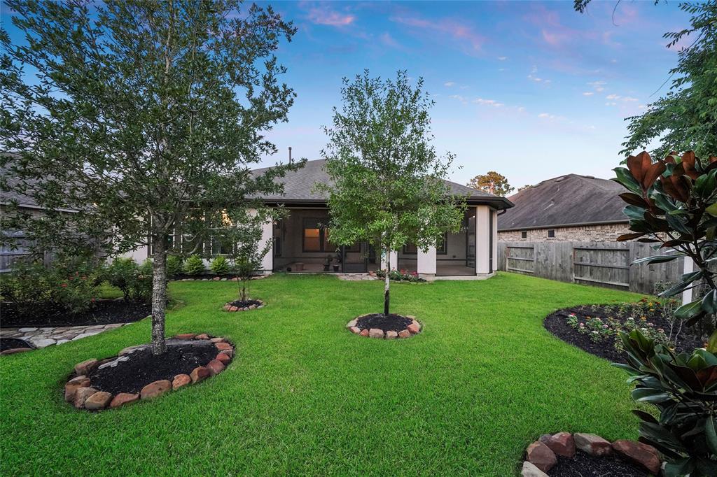 Lush landscaping, mature trees and zoned sprinkler system