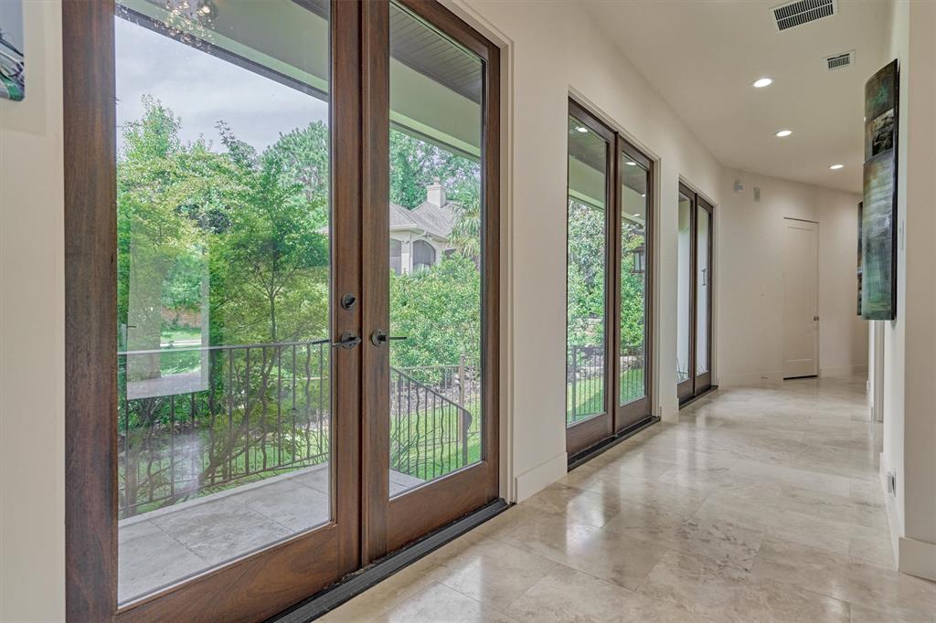Walls of full light doors provide you a view of the fully fenced courtyard. This is a perfect place for pets or a private outdoor sanctuary!
