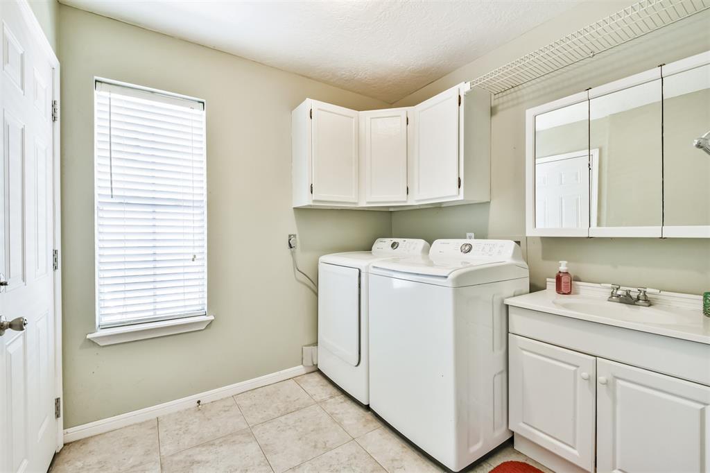 Spacious first floor laundry with sink