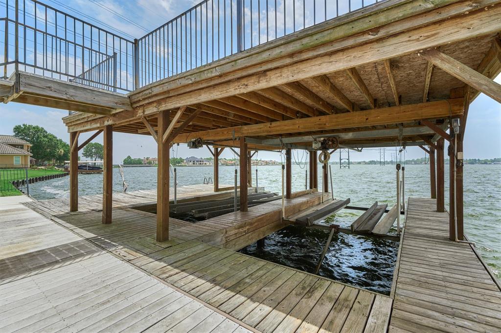 Waterfront home located on a private lot w/ a 2 slip covered boat house!
