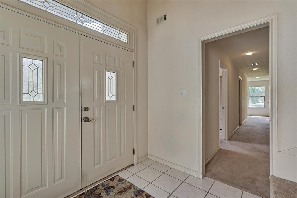 Back to the foyer, down the hall you have BR 2 & BR 3, Bath 2 plus the laundry & access outside to the carport