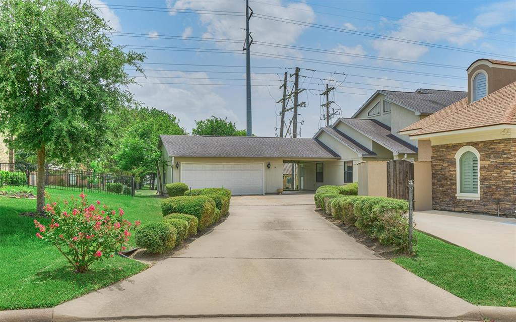 Tucked away on a private lot, this unique location affords privacy from the street Plus a utility easement to the side with no neighbors to the left!