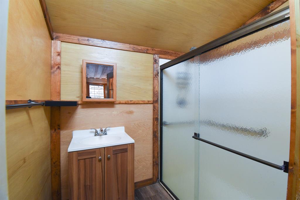 The second bathroom includes a sink and shower only.